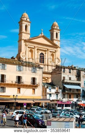 BASTIA, FRANCE - SEPTEMBER 16, 2018: A view of the Vieux Port, the Old Port of Bastia, in Corsica, France, highlighting the Saint-Jean-Baptiste Church with its characteristic twin bell towers
