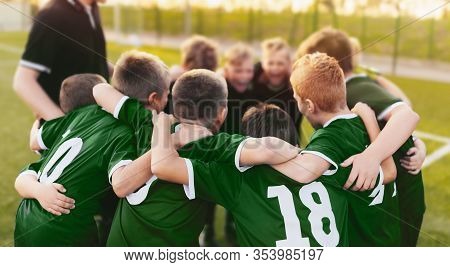 Coaching Youth Sports. Group Of Children In Soccer Team. School Football Coach’s Pregame Speech. You