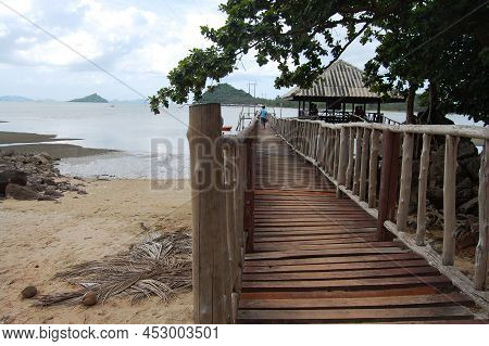 View Landscape Wooden Bridge And Boat Pier Go To Koh Pitak Or Ko Phithak Island In Gulf Of Thailand