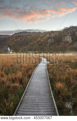 Stunning Autumn Landscape Sunrise Image Looking Towards Borrowdale Valley From Derwentwater In Lake 