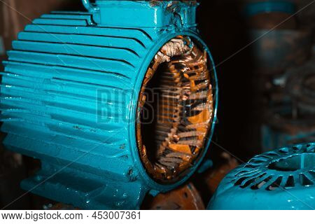 Broken Disassembled Electric Motor, Stator Under Repair In The Garage. Industrial Electrical Equipme
