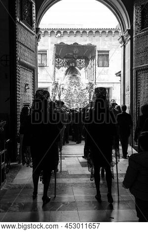 Elche, Spain- April 13, 2022: Virgin Mary On Easter Parade With Bearers And Women Wearing Mantilla D