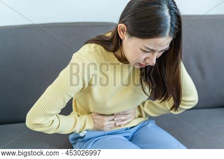 Flatulence Young Asian Woman, Girl Hand In Stomach Ache, Suffer From Food Poisoning, Abdominal Pain 
