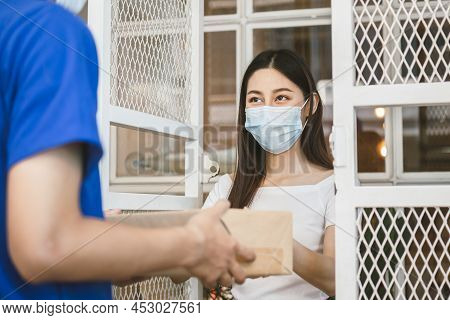 Asian Young Woman, Client Received A Delivery Of Cardboard Box, Parcel From Delivery, Postman, Weari