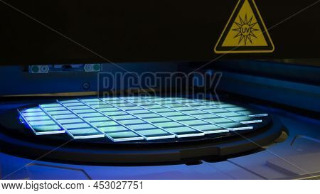 Silicon Wafer With Chips In Uv Lighting. Neon. Ultraviolet Lithography.