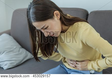 Flatulence Young Asian Woman, Girl Hand In Stomach Ache, Suffer From Food Poisoning, Abdominal Pain 