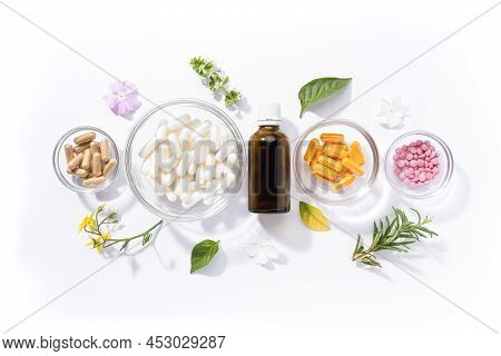 Flat Lay Composition Of Various Vitamin Capsules And Dietary Supplements Isolated On White Backgroun