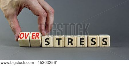 Over Stress Symbol. Psychologist Turns Wooden Cubes And Changes The Concept Word Stress To Over Stre