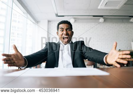Close-up Low-angle View Of Excited Annoyed African American Business Man Throwing Up Paper Account D
