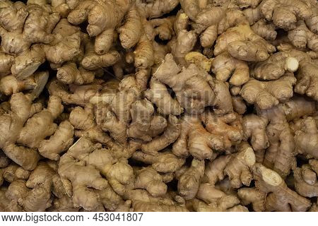 Fresh Ginger Roots In Bulk On The Market.