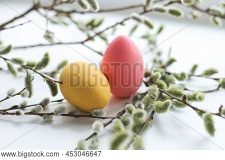 Colored Easter Eggs With A Close-up Of Willow, On A White Background. Holiday Concept