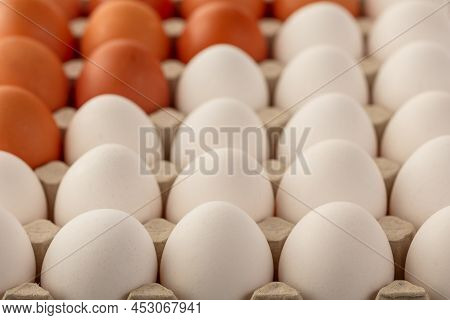 Chicken Eggs Brown And White In A Tray. Top View From An Angle.