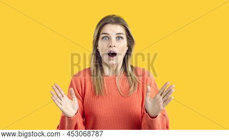 Portrait Of Surprised And Amazed Young Woman Looking At You With Wide Open Mouth And Big Eyes.
