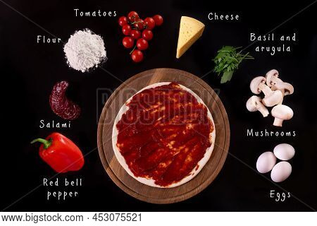 Ingredients For Italian Pizza On A Black Background Isolated. Each Ingridient Is Discription