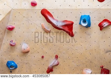 Stone Hooks Or Grips On The Artificial Climbing Wall In Bouldering Gym.
