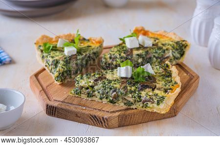 Unsweetened Sliced Open Pie, Shortcrust Pastry Quiche Stuffed With Spinach, Mushrooms And Cheese On 