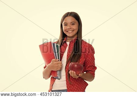 Happy Teen Girl Hold School Copybook For Studying And Apple Lunch Isolated On White, Healthy Lunch