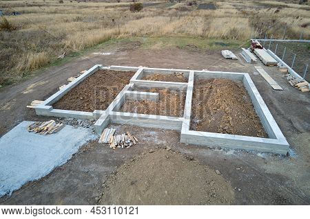 Top Down Aerial View Of Building Works Of New House Concrete Foundation On Construction Site