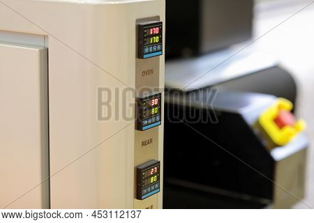 Digital Temperature Controllers On A Control Panel Of Industrial Textile Printing Machine. Selective