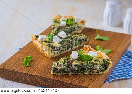 Unsweetened Sliced Open Pie, Shortcrust Pastry Quiche Stuffed With Spinach, Mushrooms And Cheese On 