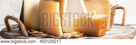 Cheese Board Of Various Types Of Soft And Hard Cheese. Spanish Manchego Cheese, International Dairy 