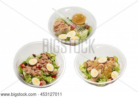 Fresh Tuna Salad With Lettuce, Cucombers, Cherries And Eggs In Plastic Container.  Top View.