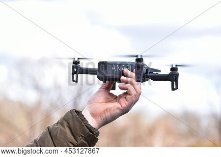 10 April 2022 - Krakow, Poland: Man Launches Drone Parrot Anafi Thermal Flying Into The Air