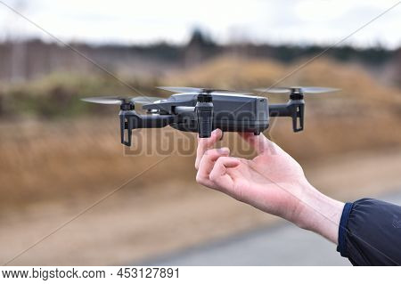 10 April 2022 - Krakow, Poland: Man Launches Drone Parrot Anafi Thermal Flying Into The Air