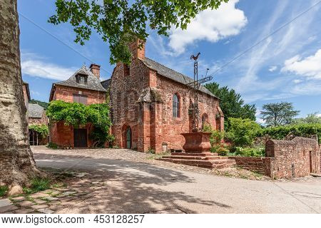 View From Central Square Du Lavoir Onto Chapel Of Black Penitents And Arma Cristi In collonges-la-ro