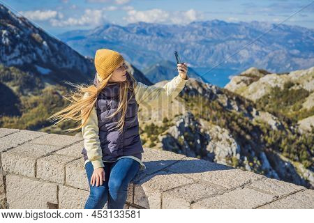 Woman Traveller In Mountain Landscape At National Park Lovcen, Montenegro. Travel To Montenegro Conc