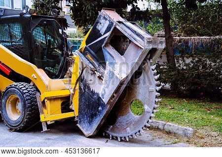 Heavy Machine Drum Cutter And A Trencher For Cable Laying And Construction Work. Orange Road Constru