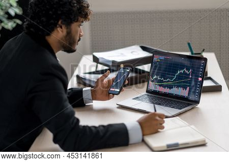 Cryptocurrency And Investment Market. Crypto Trader Investor Broker Using Smartphone And Laptop For 