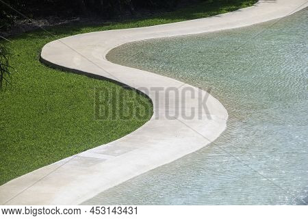 Detail Of A Swimming Pool In The Landscape Of A Public Park In Playa Del Carmen, Mexico