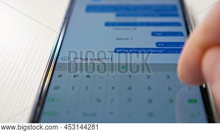 Man Sends Message Fack You Using Cellphone, Close Up