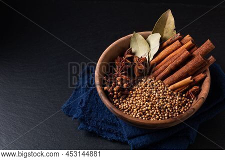 Food Ingredient Thai Five Spice In Wooden Bowl On Black Slate Stone Board With Copy Space