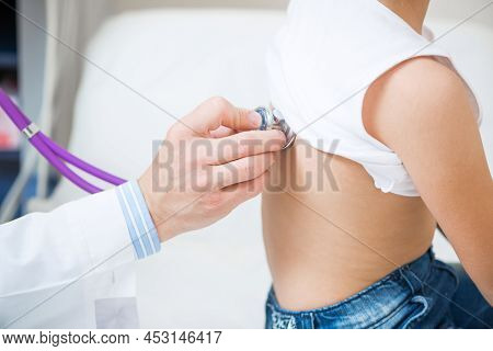 Pediatrician Examining Little Child With Stethoscope. Medical Examination Of Little Girl. Profession