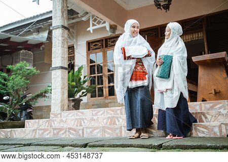 Asian Muslim With Hijab Standing In Front Of The House