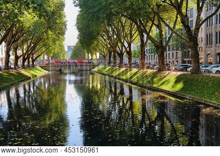 Dusseldorf, Germany - September 19, 2020: People Visit Konigsallee, Famous Shopping Destination In D