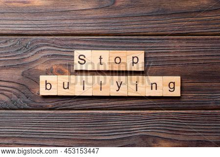 Stop Bullying Word Written On Wood Block. Stop Bullying Text On Cement Table For Your Desing, Concep