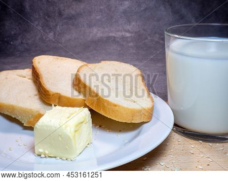 Pieces Of Rye And White Bread With A Glass Of Milk On A Plate. Healthy Breakfast. Bakery Products Wi