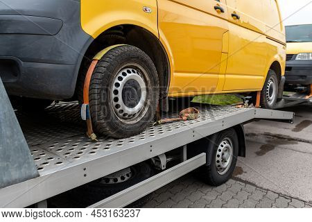 White Small Cargo Truck Car Carrier Loaded With Two Yellow Van Minibus On Flatbed Platform And Semi 