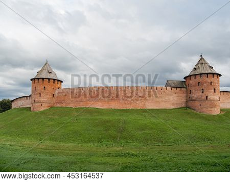 Walls And Fyodorovskaya And Mitropolichya Towers Of Novgorod Kremlin. Summer Cloudy Day In Veliky No