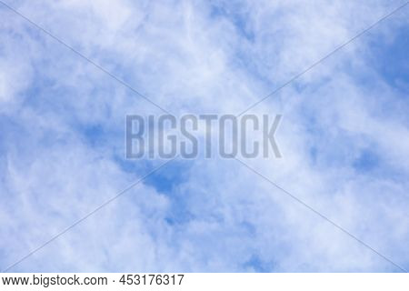 Blue Sky And White Clouds Float Across The Sky On A Clear Day. Background And Abstraction Of The Sky