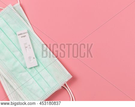 Top View Or Flat Lay Of Covid-19 Negative Test Result Antigen Test Kit (atk) On Medical Face Masks  