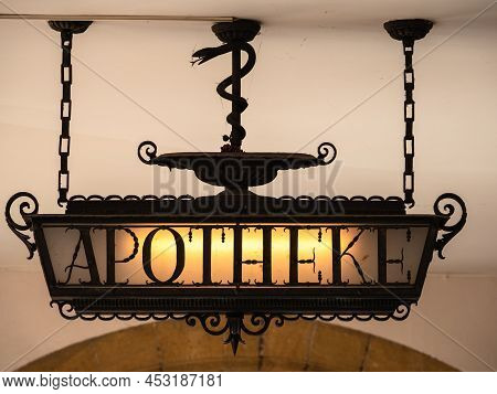 Historical Illuminated Pharmacy Board With The German Inscription Apotheke - Translation: Pharmacy