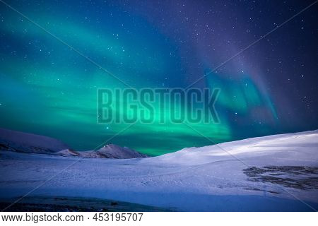 Northern Lights Or Aurora Borealis In The Beautiful Sky.