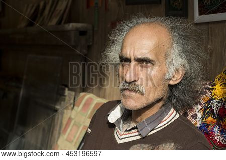 Masuleh, Iran - December 22, 2017 Old Man Close Up Portrait At His Shop, Selling Earthenware Artwork