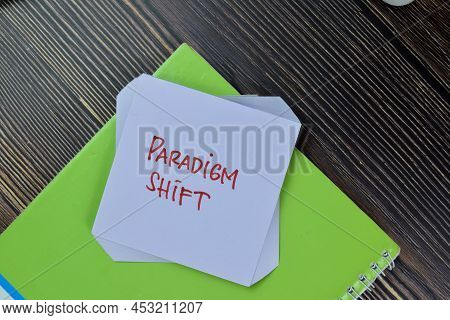 Paradigm Shift Write On Sticky Notes Isolated On Wooden Table.