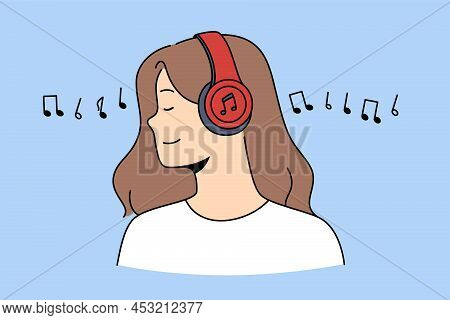Side View Of Happy Relaxed Girl In Wireless Headphones Listen To Music. Smiling Young Woman In Moder