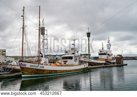 Husavik, Iceland - June 2019: Traditional Old Wooden Fisherman Boats Used For Whale Watching In Husa